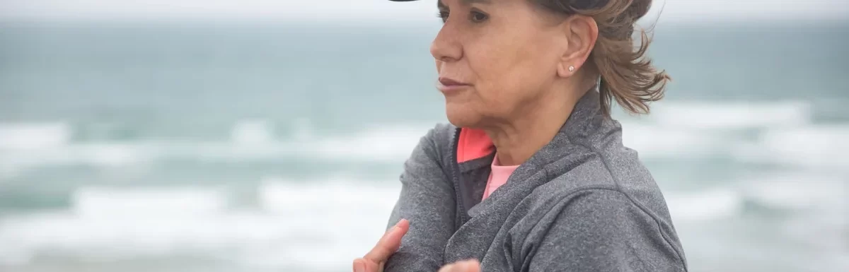 Woman exercising beside the sea