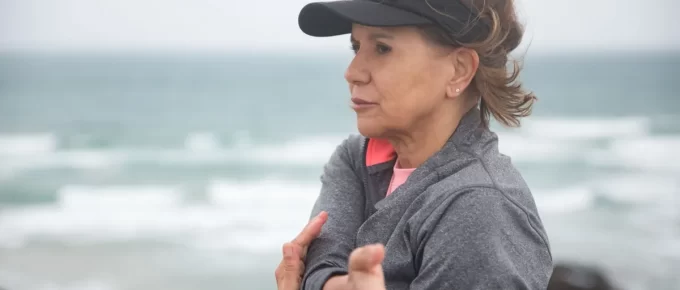 Woman exercising beside the sea
